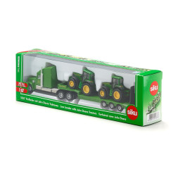 Freightliner Coronado with low loader and John Deere tractors
