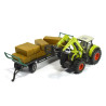 Claas Axion 850 tractor met balengrijper en aanhangwagen