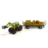 Claas Axion 850 tractor met balengrijper en aanhangwagen