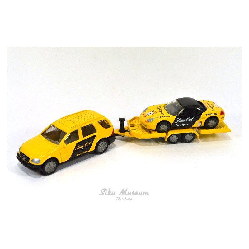 Mercedes ML 320 mit AnhÃ¤nger und Tourenwagen