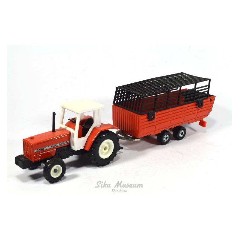 Massey Ferguson with hay trailer