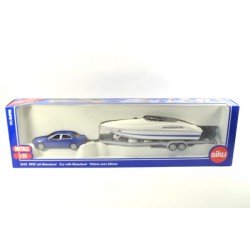 BMW 545i with trailer and speedboat